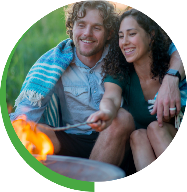 Couple sitting by a fire pit