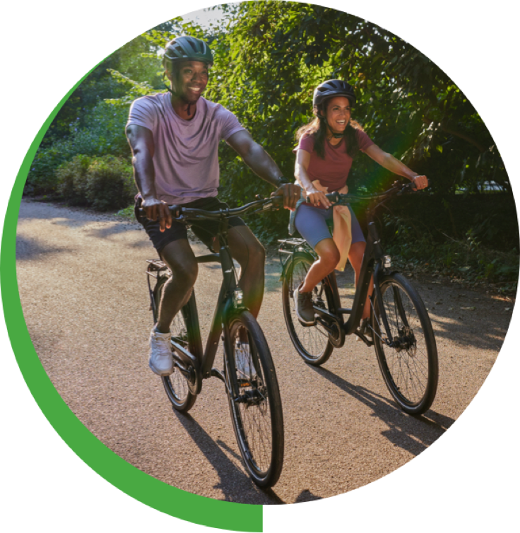 Man and woman riding bikes outdoors