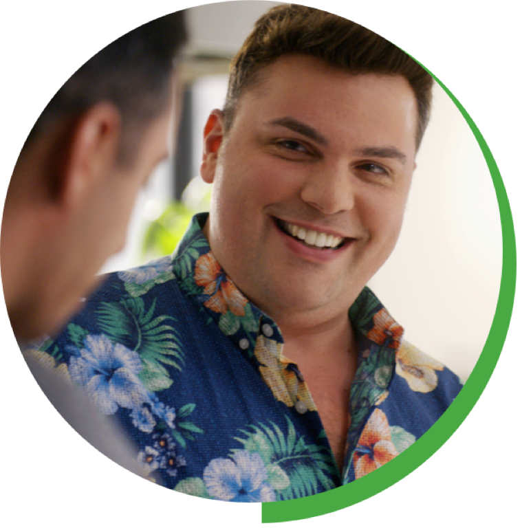 Man in hawaiian shirt smiling